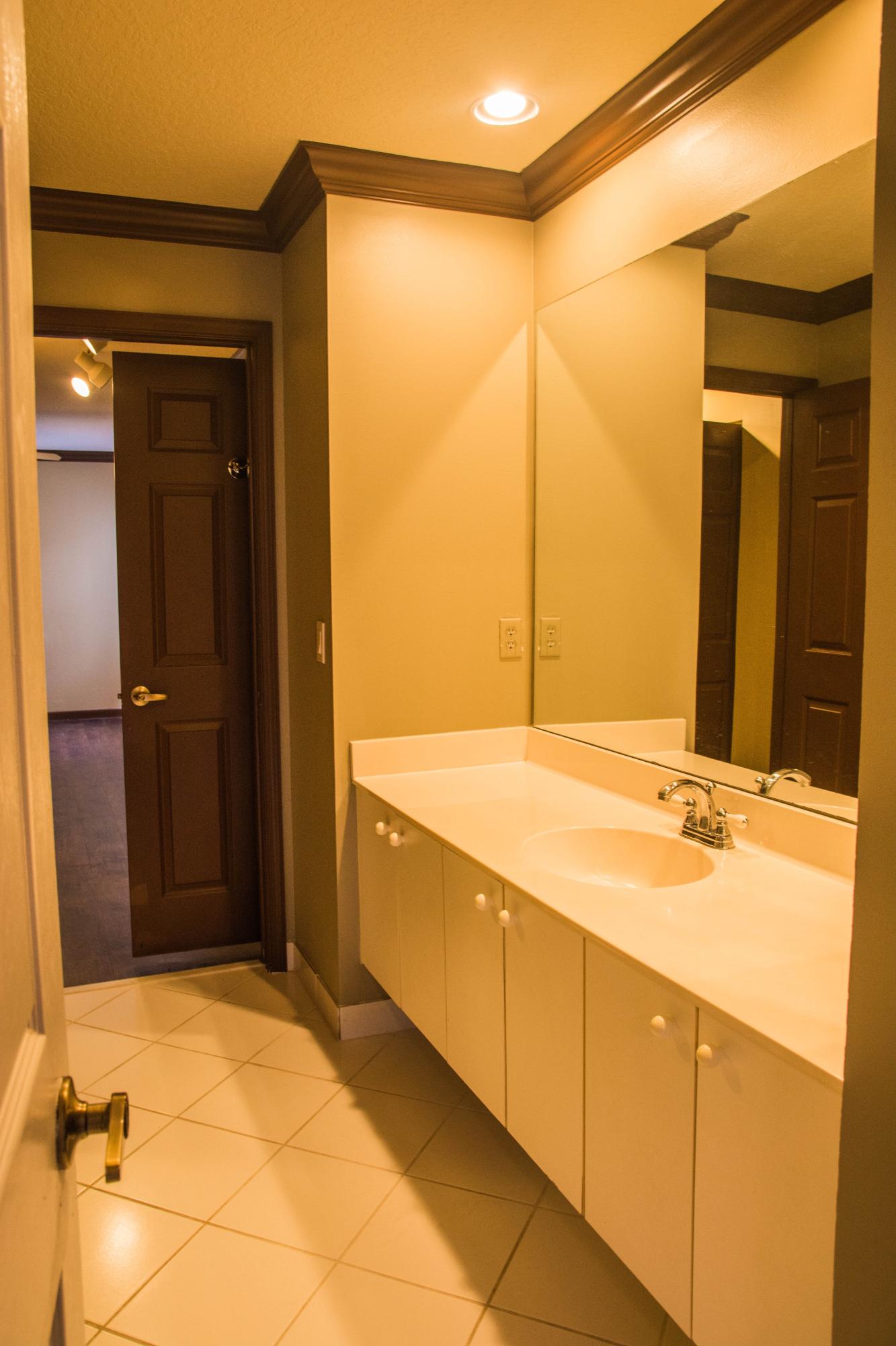 17234 Ventana Drive Boca Raton, FL 33487 - Photo 24 of 27 a bathroom with a tub shower and sink