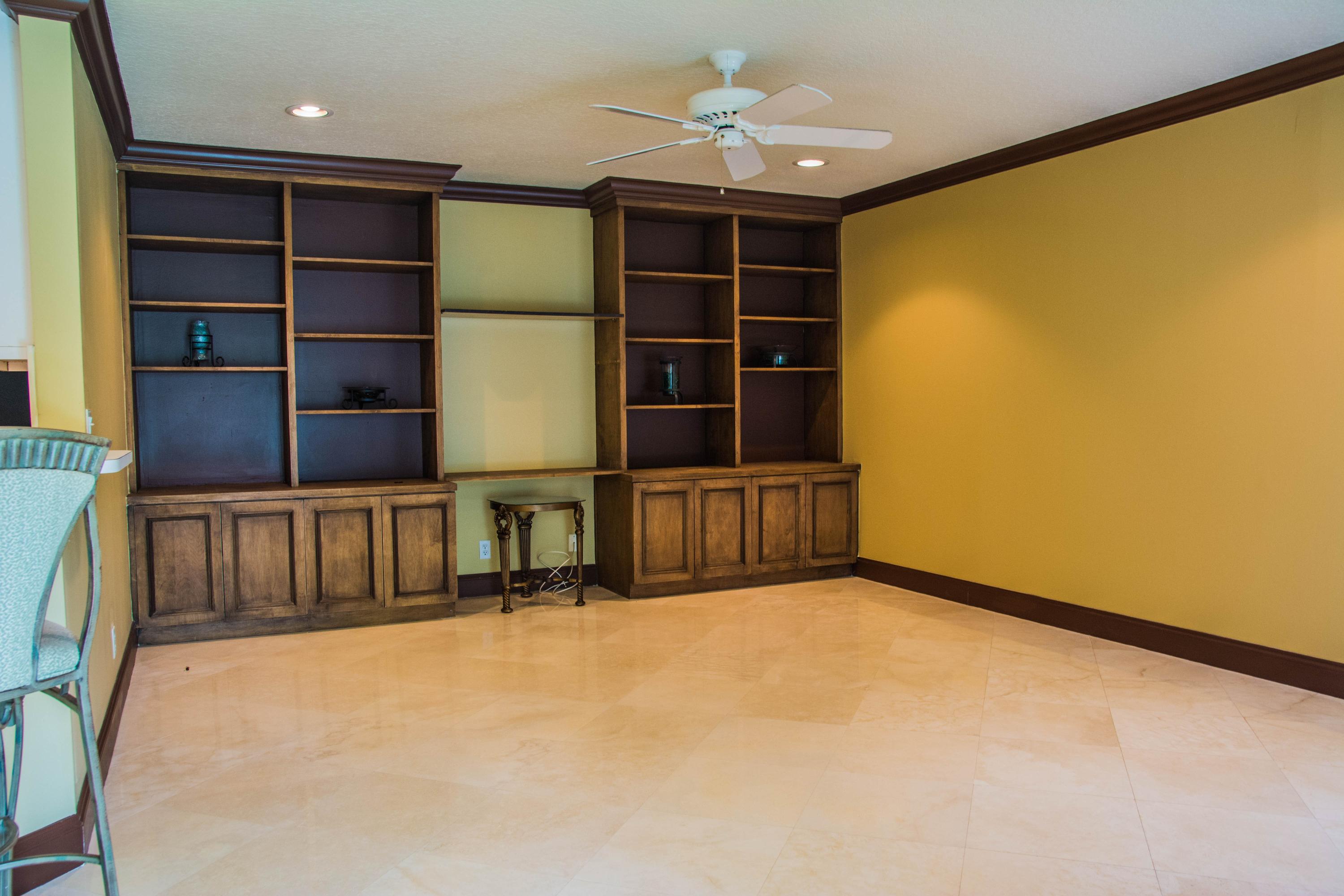 17234 Ventana Drive Boca Raton, FL 33487 - Photo 9 of 27 a view of an empty room with a empty shelves