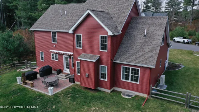 a view of entryway livingroom and hall with wooden floor