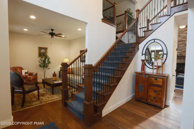 a kitchen with granite countertop a stove refrigerator and microwave