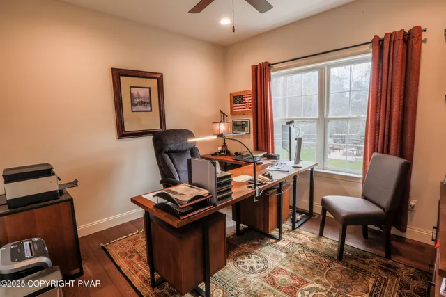 a bedroom with furniture and a window