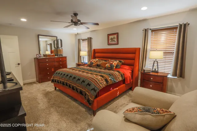 a bathroom with a sink a toilet and a shower