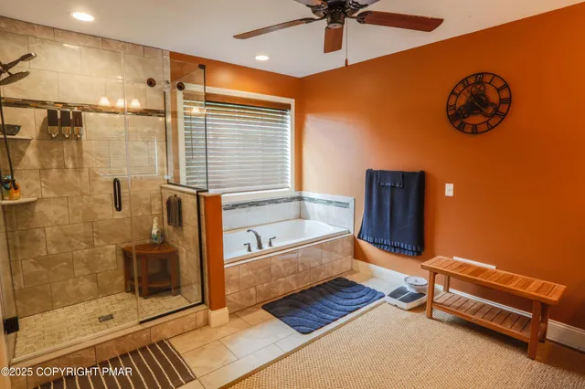 a spacious bathroom with a double vanity sink and a mirror