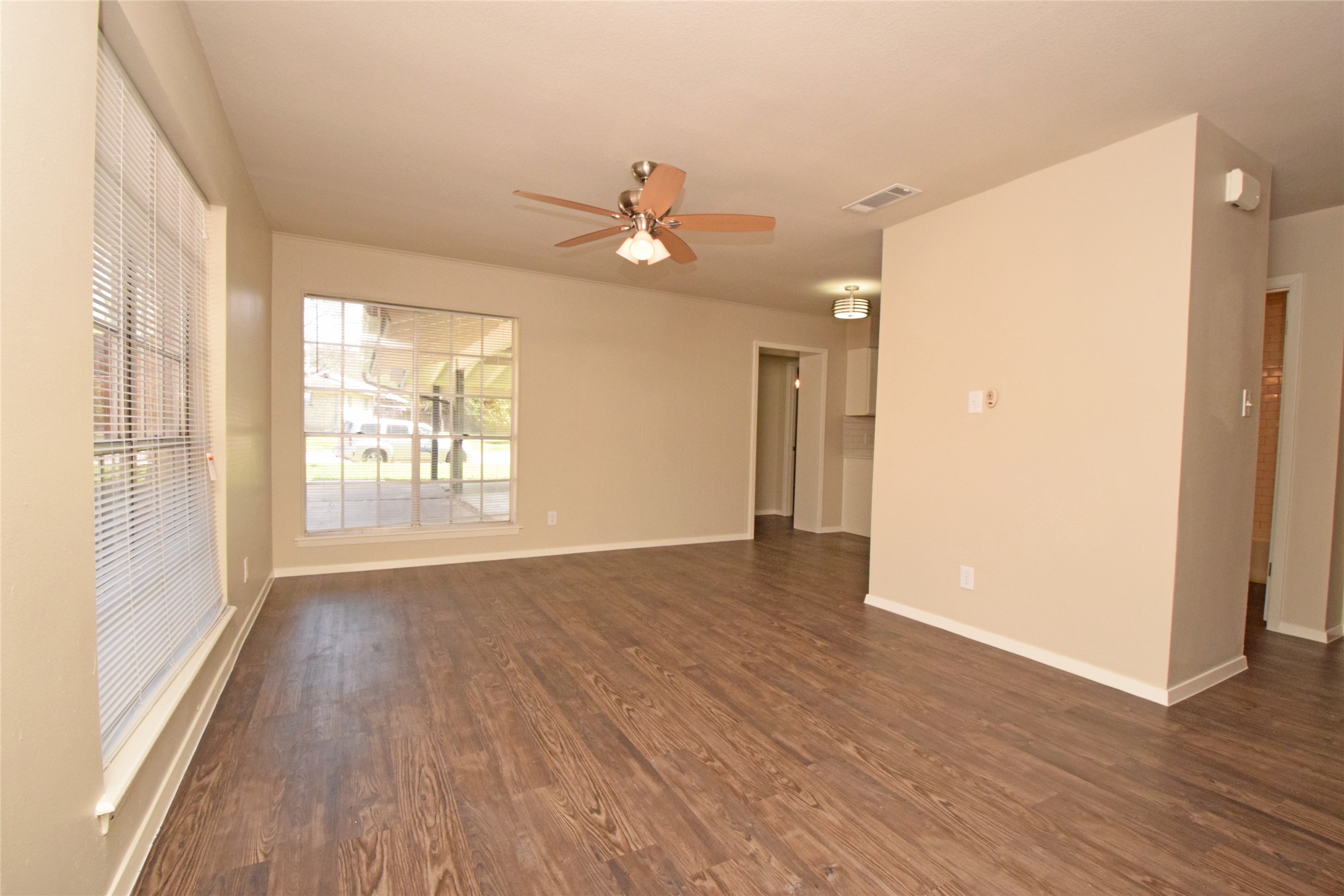 6400 Brookside Drive Austin, TX 78723 - Photo 19 of 26 Unfurnished room with a ceiling fan and dark wood-type flooring