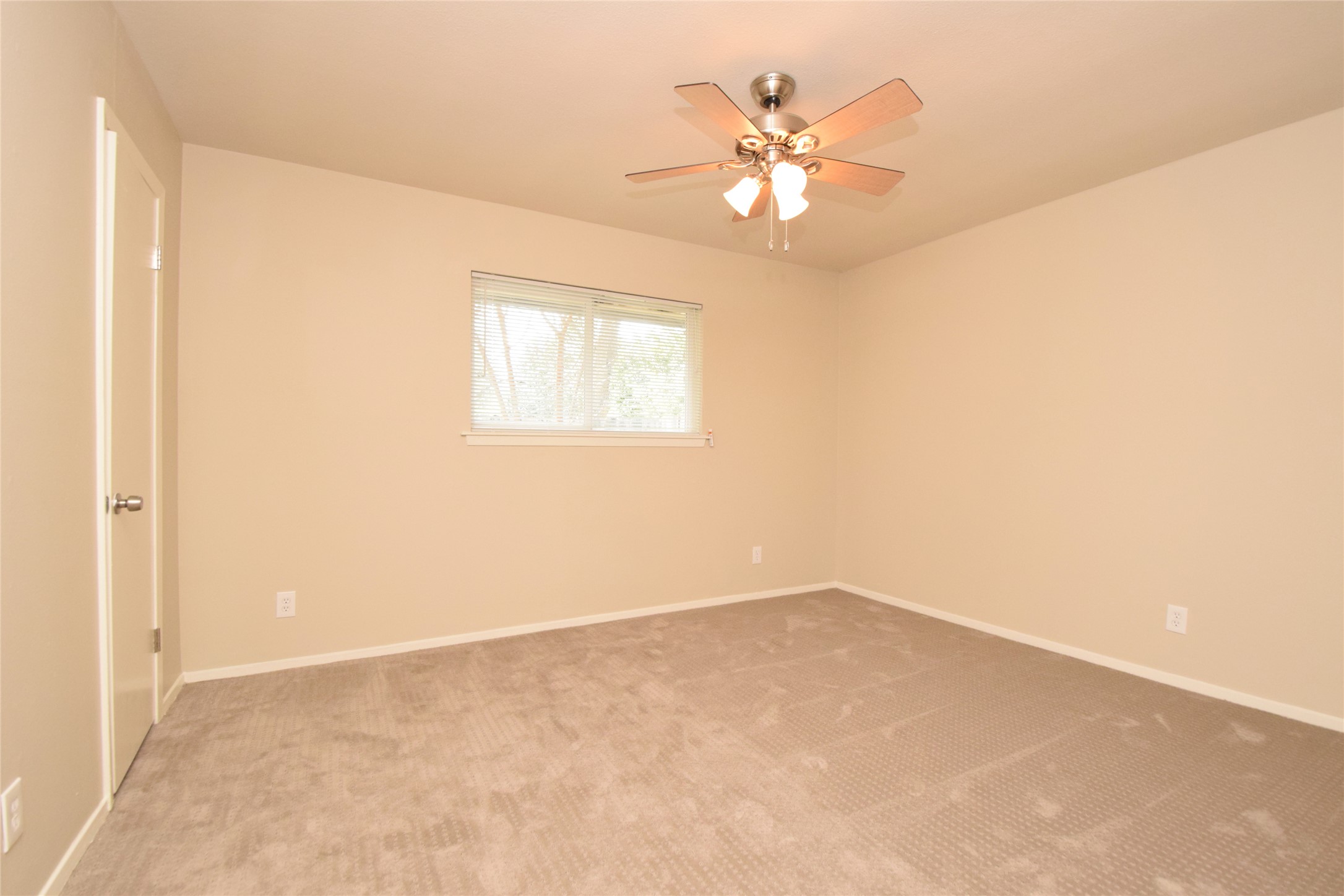 6400 Brookside Drive Austin, TX 78723 - Photo 24 of 26 Unfurnished room featuring carpet flooring and a ceiling fan