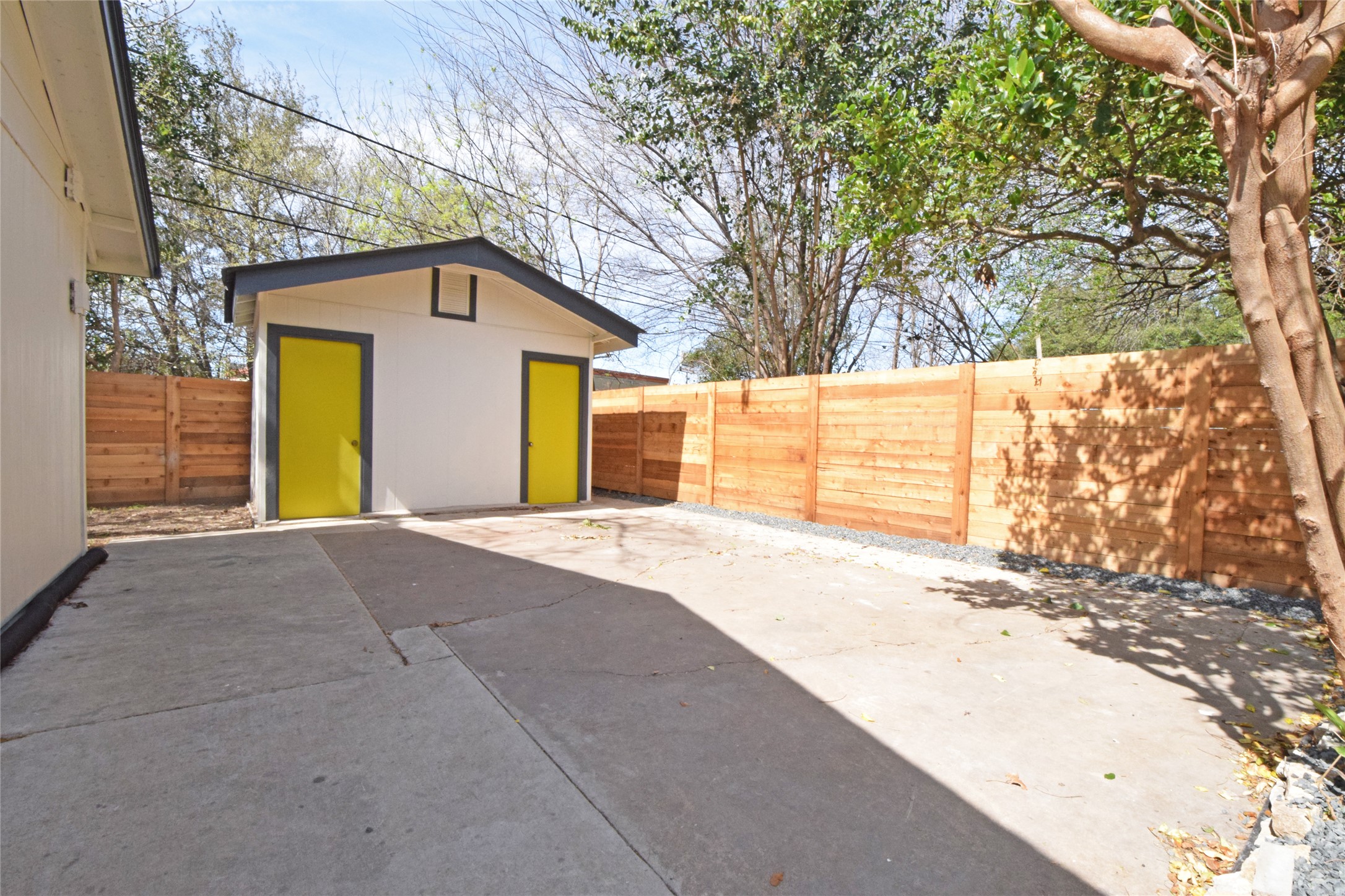 6400 Brookside Drive Austin, TX 78723 - Photo 25 of 26 Fenced backyard with a patio area and an outdoor structure
