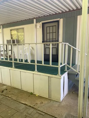 a view of a house with a yard and garage