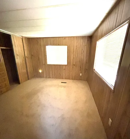 a view of an house with backyard porch and wooden floor