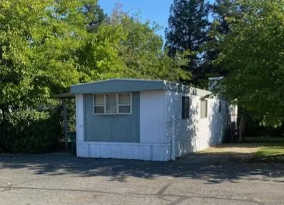 a view of a two chair under an umbrella