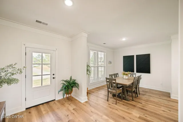 a workspace with furniture window and wooden floor