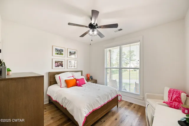 a bed room with a bed and a window