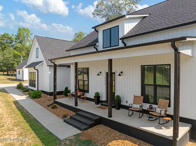 a view of a house with sitting area and furniture