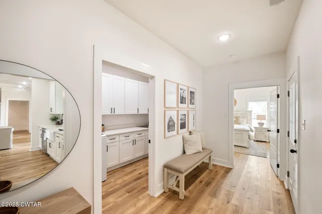 workspace with wooden floor and a mirror