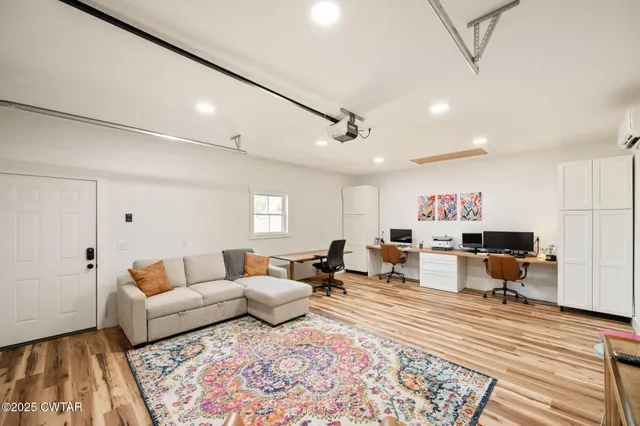 a living room with furniture and a rug