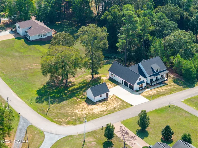 an aerial view of a house with a garden