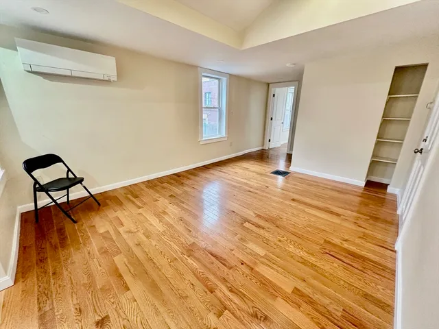 a kitchen with a refrigerator sink and cabinets