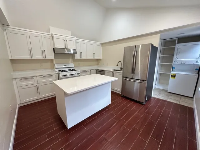 a bathroom with a bathtub a sink a toilet a mirror and shower