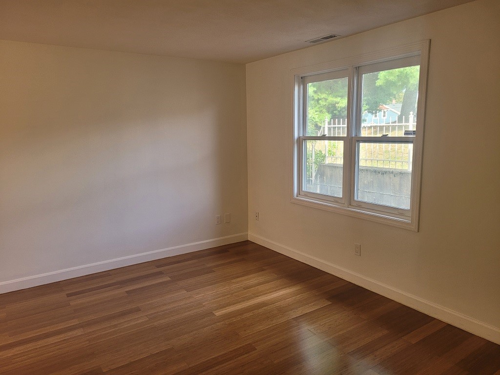 3399 Post Road, Unit 27 Warwick, RI 02886 - Photo 12 of 36 Lots of light with gorgeous Bamboo flooring