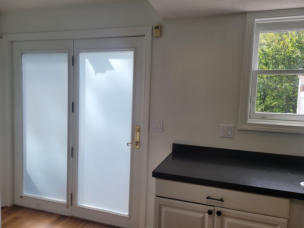 3399 Post Road, Unit 27 Warwick, RI 02886 - Photo 7 of 36 Double frosted door to large deck