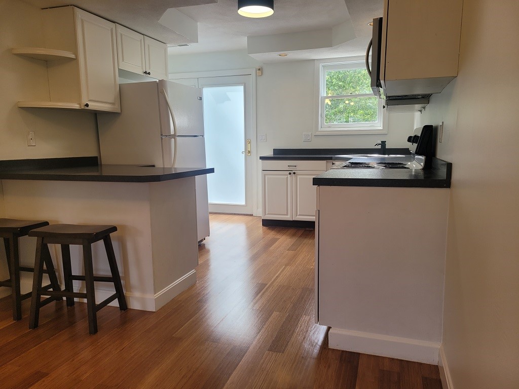 3399 Post Road, Unit 27 Warwick, RI 02886 - Photo 9 of 36 Hardwoods throughout first level