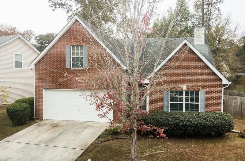 3635 Sugar Maple Street Decatur, GA 30034 - Photo 1 of 1 a front view of a house with a yard and potted plants