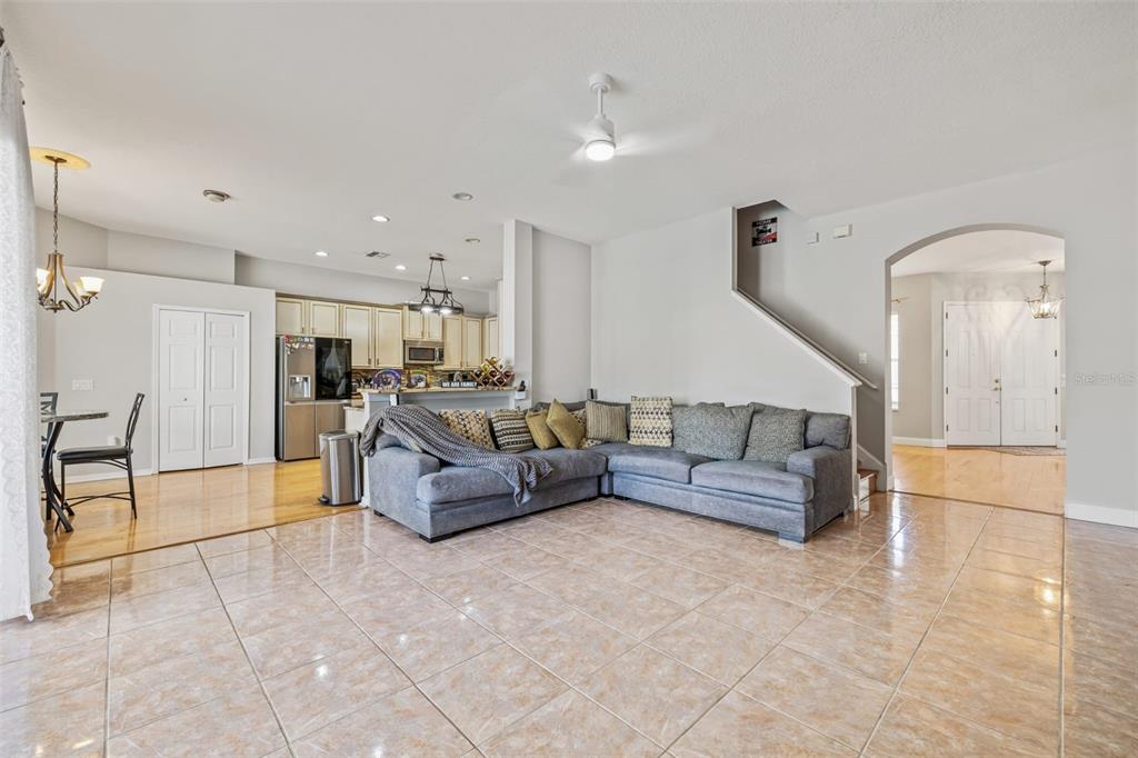 22623 Cliffside Way Land O' Lakes, FL 34639 - Photo 21 of 49 a living room with furniture and a dining table with kitchen view