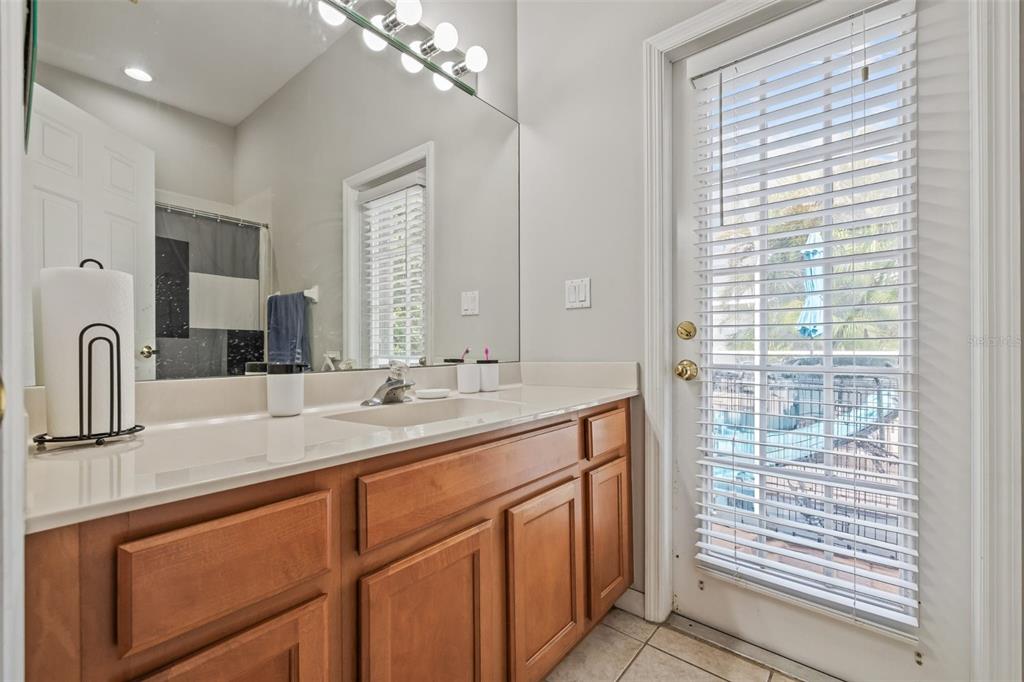 22623 Cliffside Way Land O' Lakes, FL 34639 - Photo 31 of 49 a bathroom with a double vanity sink and a mirror