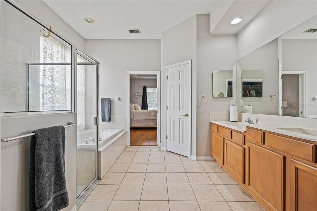 22623 Cliffside Way Land O' Lakes, FL 34639 - Photo 33 of 49 a large white kitchen with a sink and refrigerator