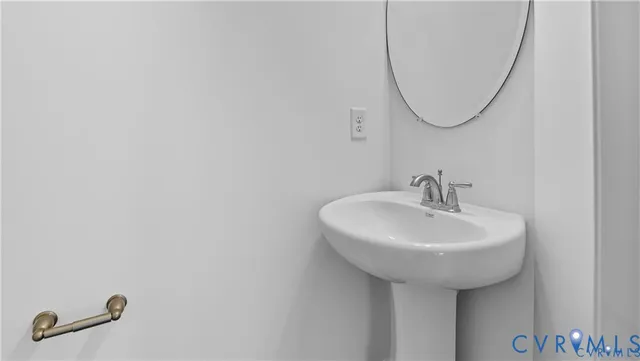 a bathroom with a sink a mirror and a shower