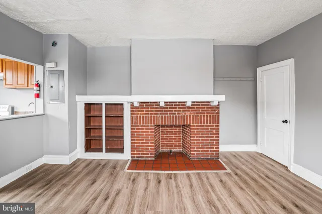 a view of wooden floor and windows in a room