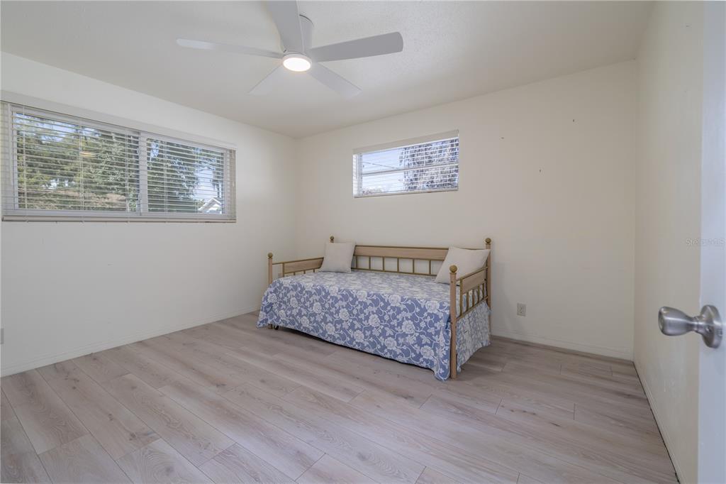 1016 Cherokee Ranch Road Holly Hill, FL 32117 - Photo 16 of 23 a bedroom with a bed and a window