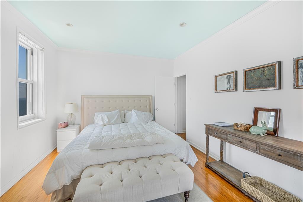 286 Corbin Place, Unit 5E Brooklyn, NY 11235 - Photo 15 of 35 a bedroom with a bed and dresser