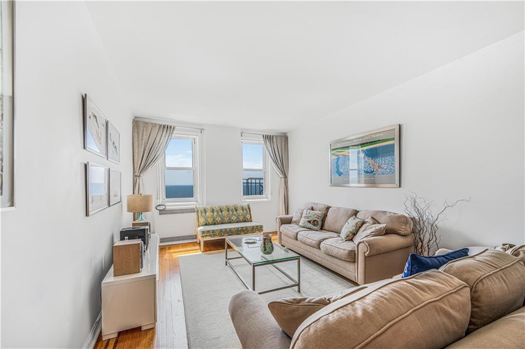 286 Corbin Place, Unit 5E Brooklyn, NY 11235 - Photo 2 of 35 a living room with furniture and a large window