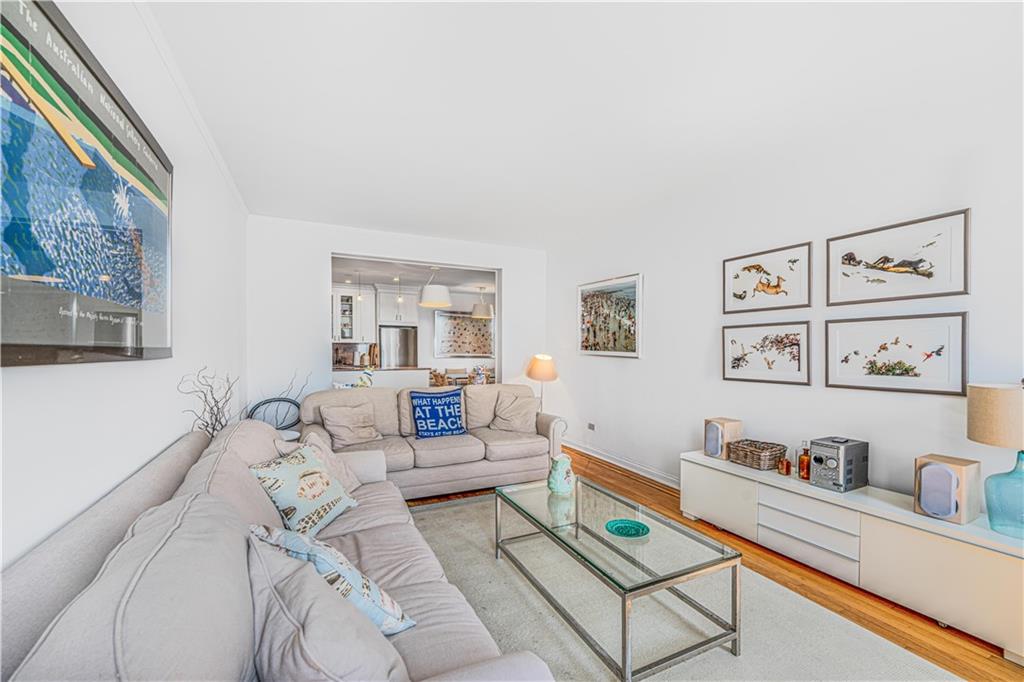 286 Corbin Place, Unit 5E Brooklyn, NY 11235 - Photo 3 of 35 a living room with furniture and window
