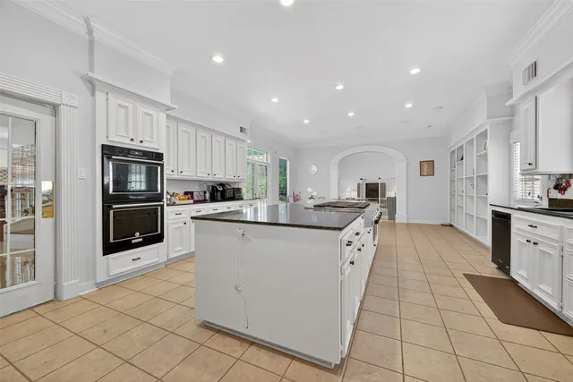 a kitchen with stainless steel appliances granite countertop a sink and cabinets