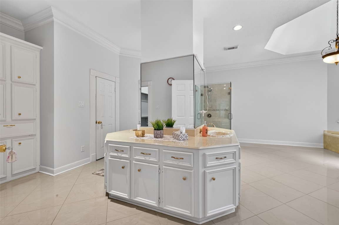 17318 Rothko Lane Spring, TX 77379 - Photo 20 of 46 a spacious bathroom with a double vanity sink and a mirror