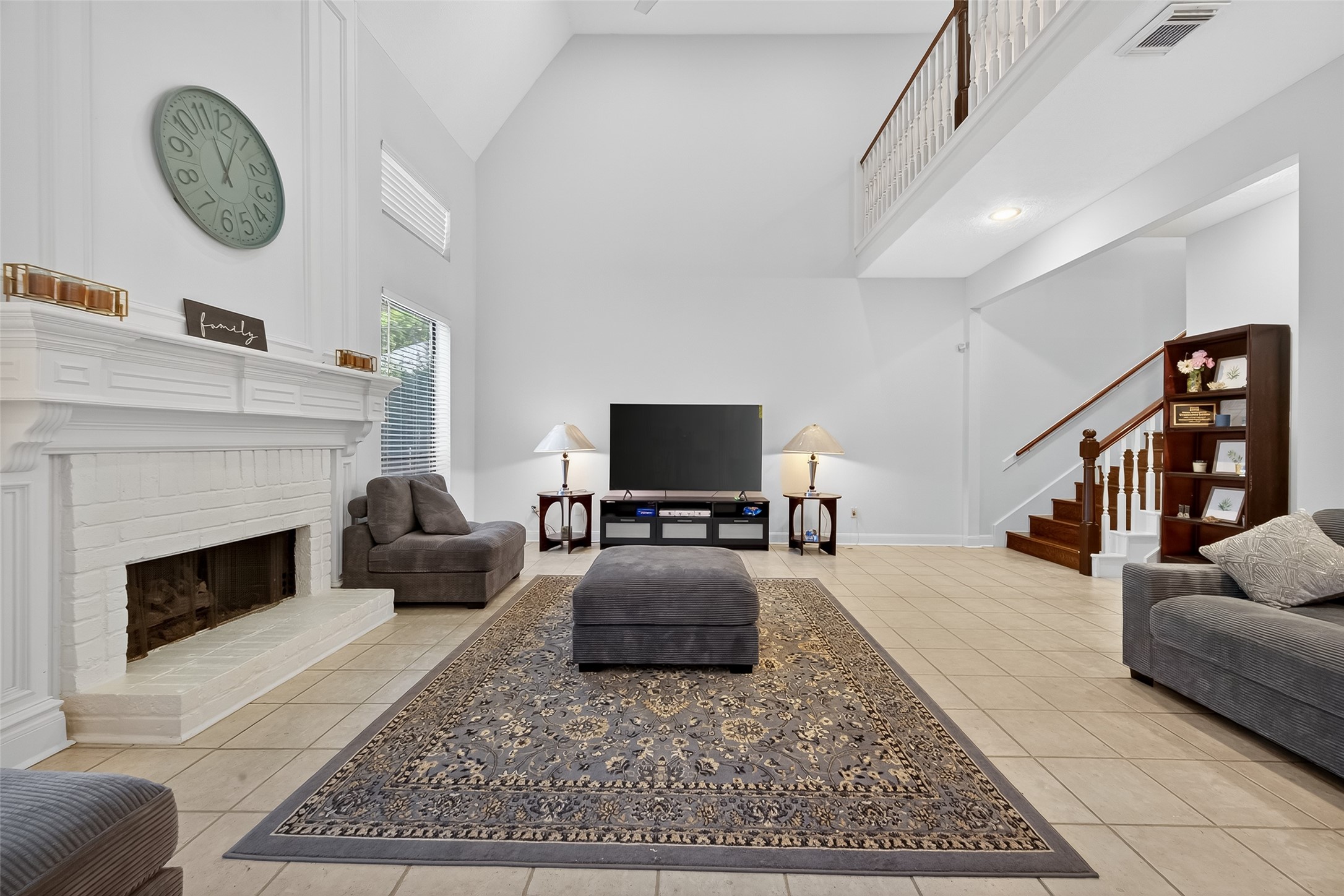 17318 Rothko Lane Spring, TX 77379 - Photo 24 of 46 a living room with furniture a rug and a fireplace
