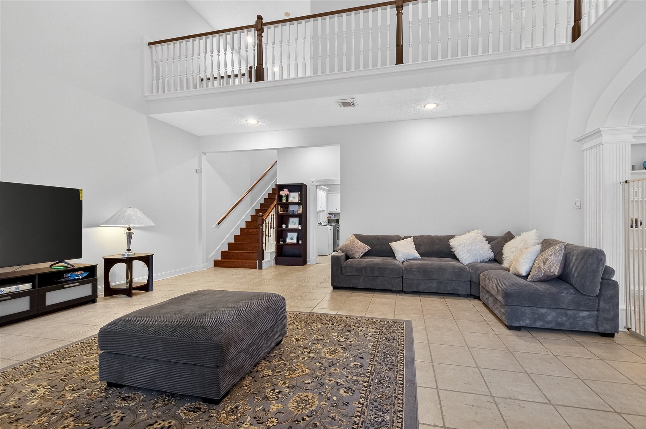 17318 Rothko Lane Spring, TX 77379 - Photo 25 of 46 a living room with furniture and a flat screen tv