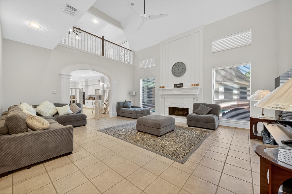 17318 Rothko Lane Spring, TX 77379 - Photo 27 of 46 a living room with furniture a rug and a fireplace