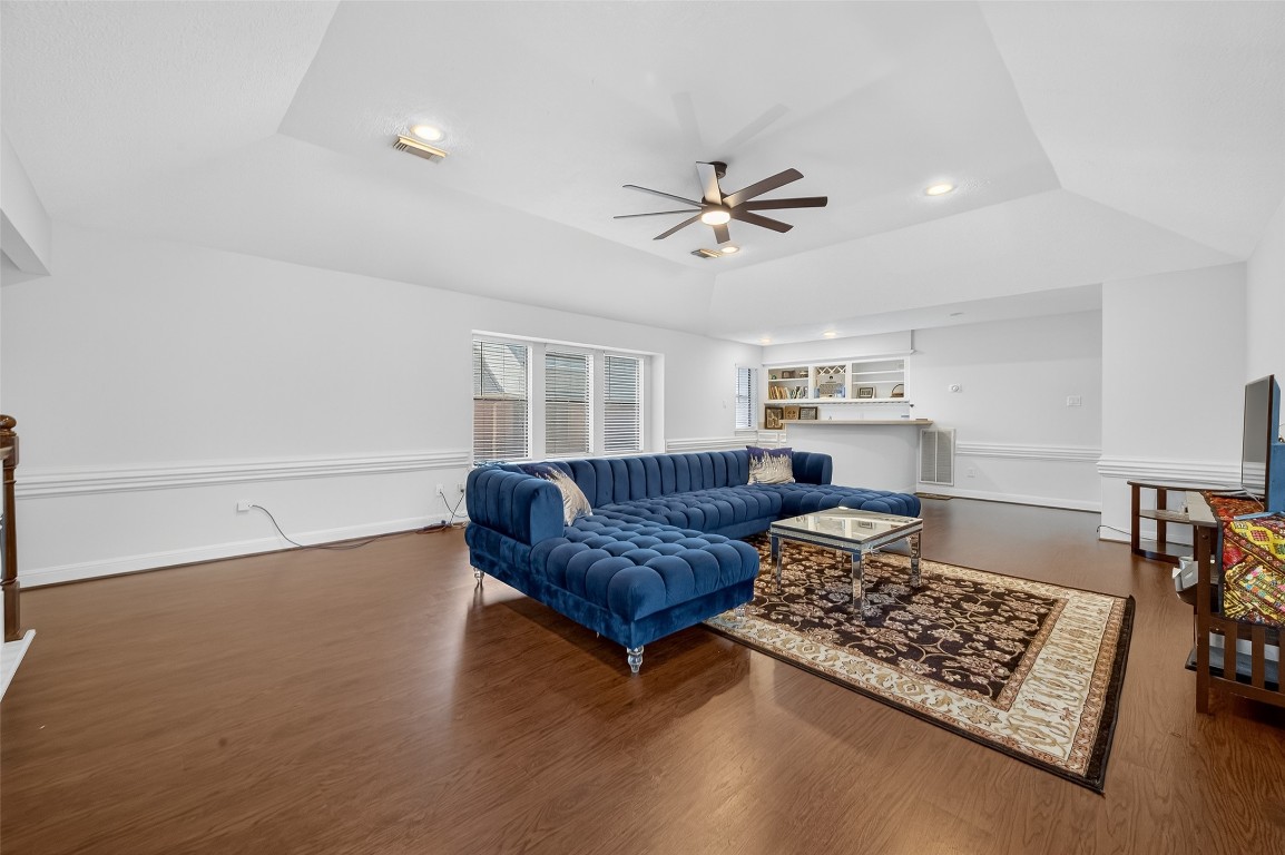 17318 Rothko Lane Spring, TX 77379 - Photo 28 of 46 a living room with furniture and a rug