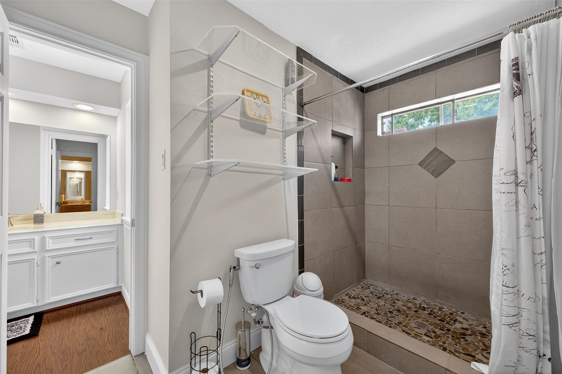 17318 Rothko Lane Spring, TX 77379 - Photo 33 of 46 a bathroom with a shower toilet and sink