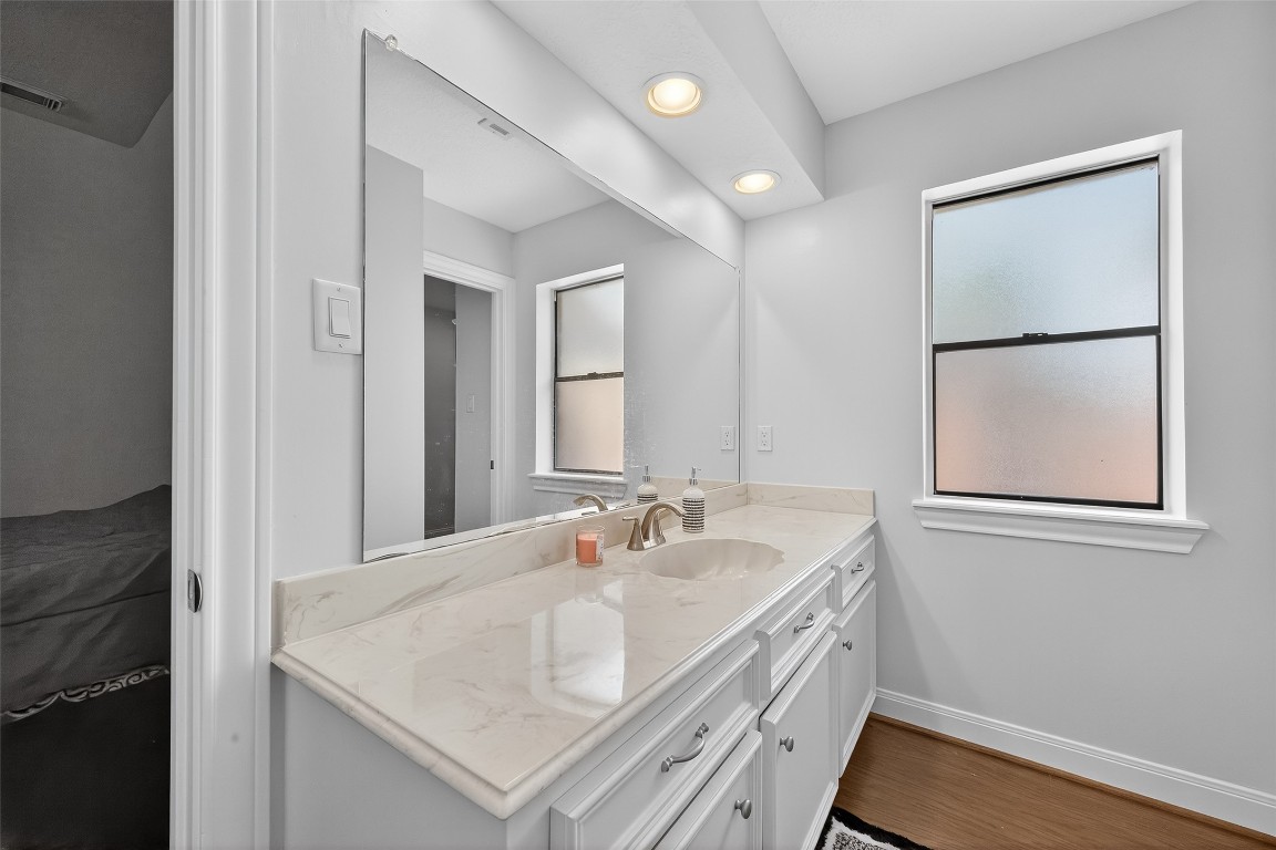 17318 Rothko Lane Spring, TX 77379 - Photo 37 of 46 a bathroom with a sink and a mirror