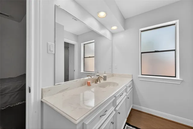 a bathroom with a sink and a mirror