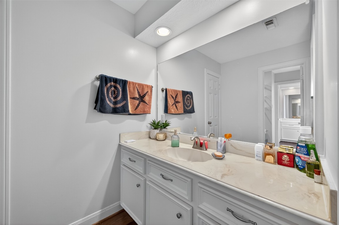 17318 Rothko Lane Spring, TX 77379 - Photo 39 of 46 a bathroom with a sink vanity and mirror