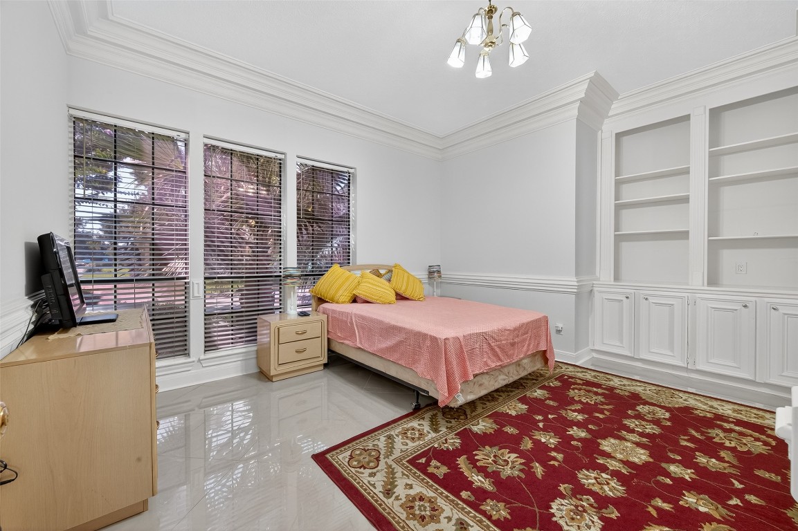17318 Rothko Lane Spring, TX 77379 - Photo 41 of 46 a spacious bedroom with a bed and glass window
