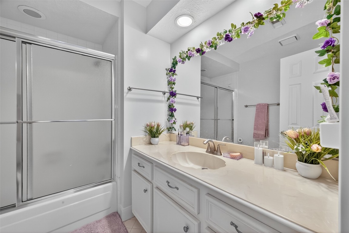 17318 Rothko Lane Spring, TX 77379 - Photo 42 of 46 a bathroom with a shower sink and a mirror