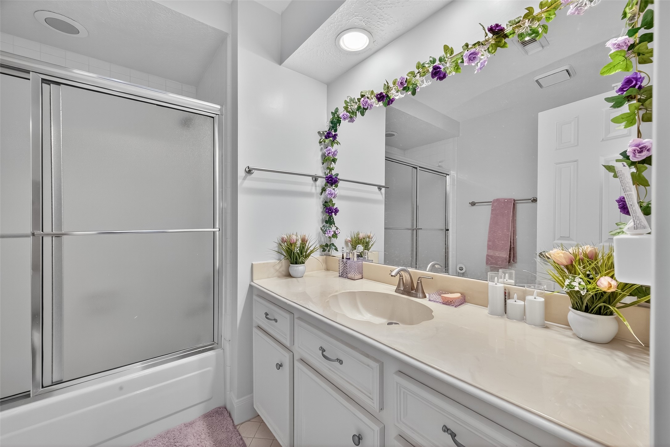 17318 Rothko Lane Spring, TX 77379 - Photo 42 of 46 a bathroom with a shower sink and a mirror