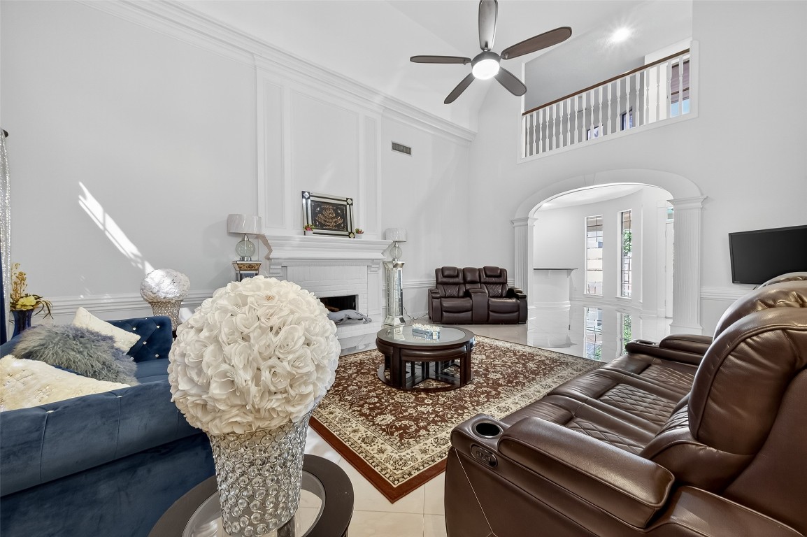 17318 Rothko Lane Spring, TX 77379 - Photo 5 of 46 a living room with furniture and a chandelier