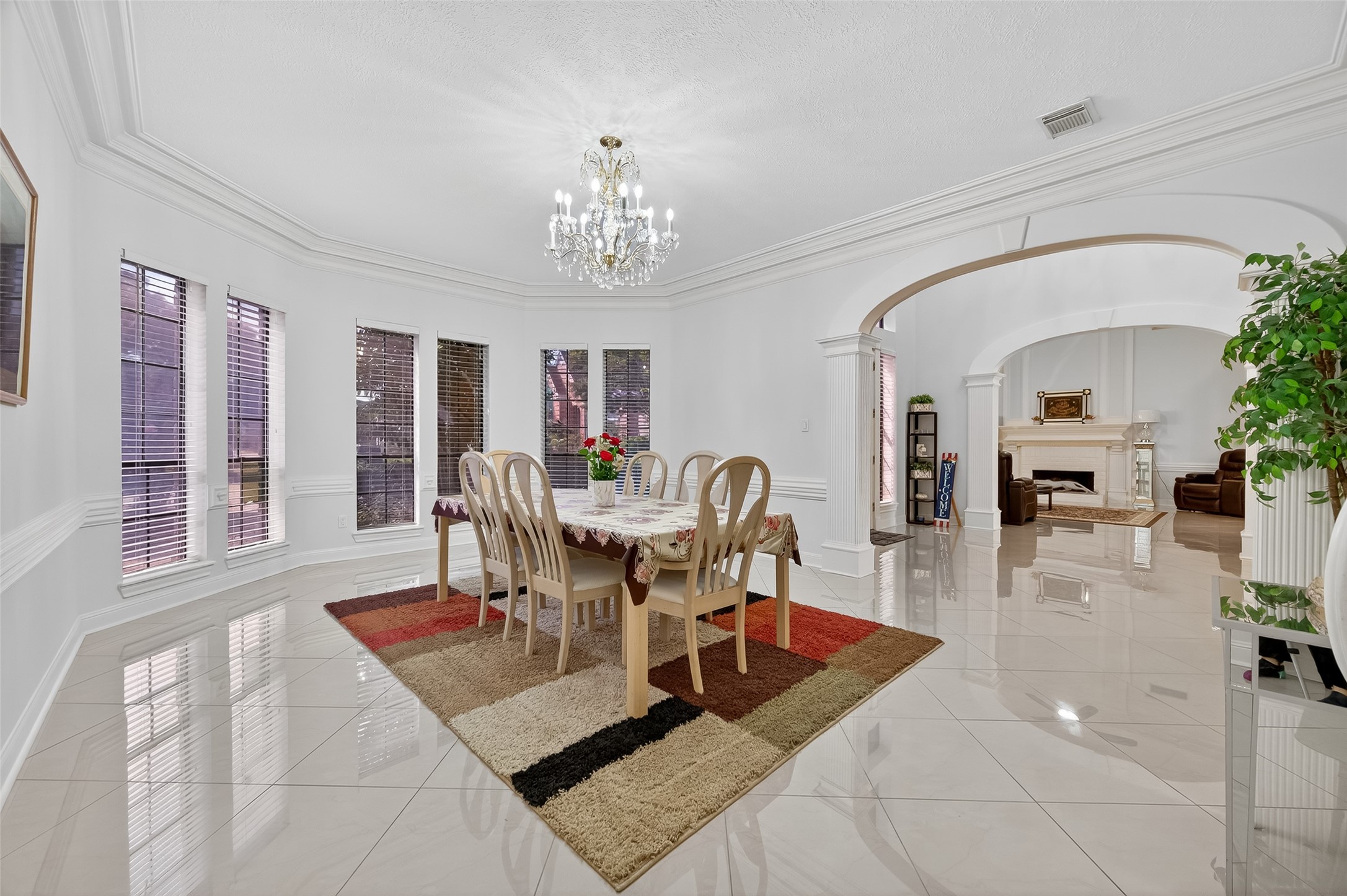 17318 Rothko Lane Spring, TX 77379 - Photo 8 of 46 a living room with furniture a chandelier and a dining table