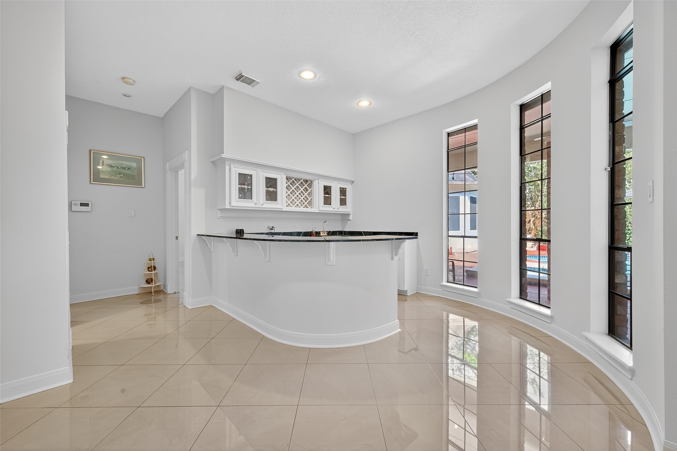 17318 Rothko Lane Spring, TX 77379 - Photo 10 of 46 a view of kitchen with granite countertop cabinets and window
